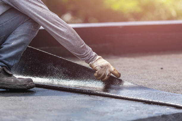 Professional Waterproofing technician working in Bath, MI